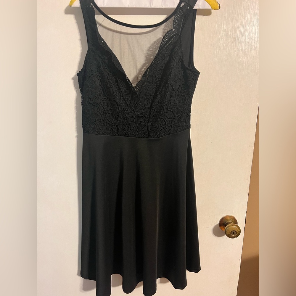 Black dress. Size Medium. Sheer overlay on chest.